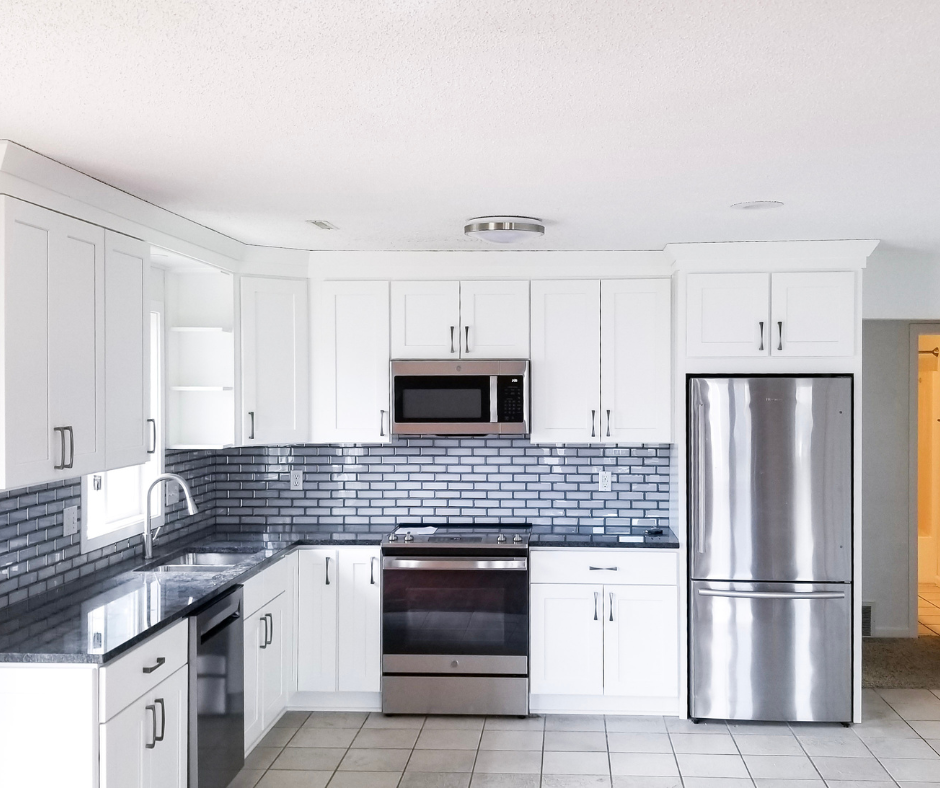 Beautiful, remodeled kitchen in the Twin Cities, Minnesota with white cabinets and stainless steel appliances